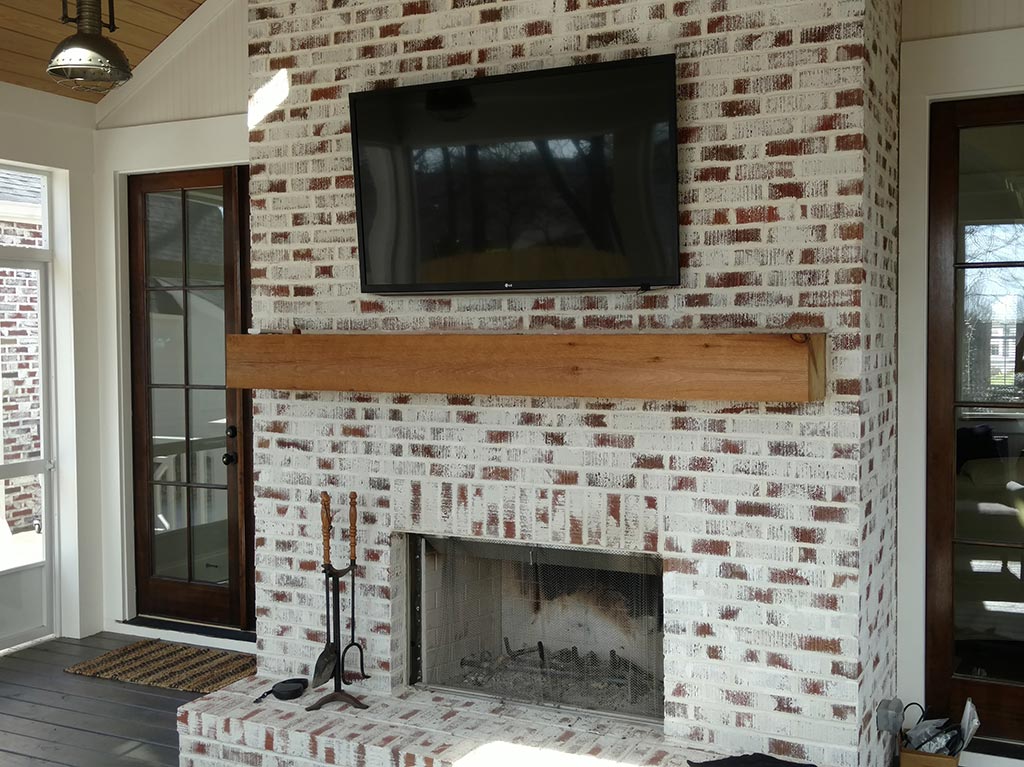 TV that we wired and installed over a masonry brick fireplace on a back porch.